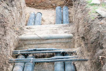 Repair of underground communications, water and hot water pipes in city.