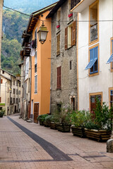 Alley between old houses in the small and charming commune of Isola, Provence-Alpes-Côte d'Azur region, Alpes-Maritimes, France