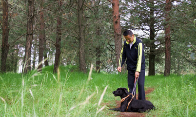 Man in a park with his dog