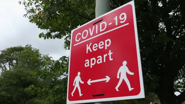 Covid-19 coronavirus sign about social distancing and keeping two metres apart