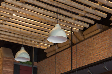 ceiling design with wooden beams modern white lamps and brick wall