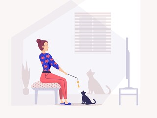 Girl watching television sitting in armchair, at home with cat.