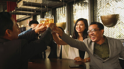 businesspeople toasting and clinking wine or champagne together
