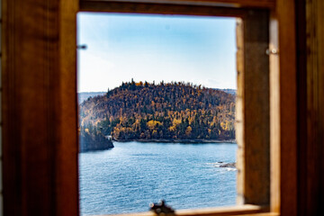 Beautiful landscape with water as seen through wooden window