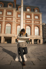 young man with map travel concept vacation adventure travel advertising gps campaign, airport opening, public transport, transportation, maps