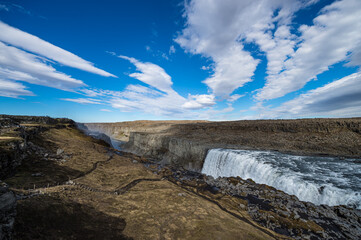 Wide angle shot of a path leading to Dettifoss waterfall in Iceland.