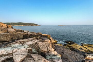 Fototapeta na wymiar Acadia National Park Coastline On Blue Sky Day