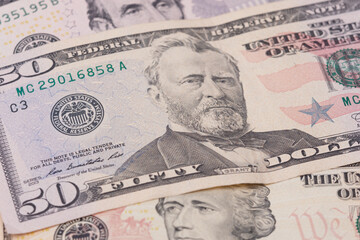 Obraz na płótnie Canvas The texture of US dollars. Background from dollar bills.