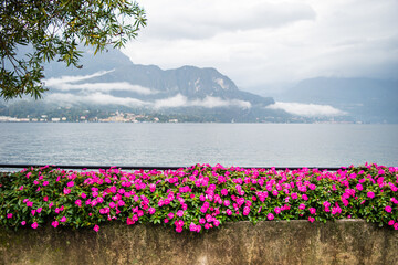 Landscape of lake Como with very cloudy sky and mountains, which is located in northern Italy.