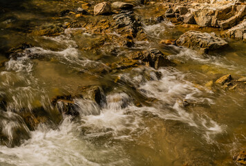 Mountain stream cascading over rocks and boulders