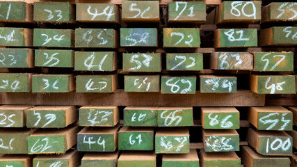A pile of marked lumber Tell the type and number