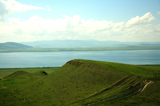 Low hills on the shores of a picturesque lake in the steppe.