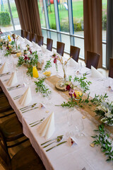 Wedding table decoration with flowers.