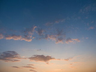Obraz premium Whimsical clouds in the blue sky. Summer evening