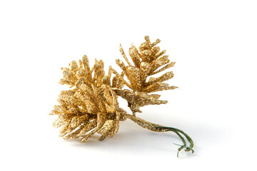 Three golden pine cones isolated on the white background