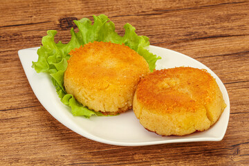 Vegan cuisine - Potato cutlet in the plate