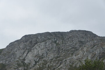 Fototapeta na wymiar Grey rocky mountain range in natural landscape.