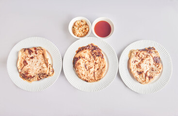 Pupusas from El Salvador dish isolated with curtido on a stylish white plate
