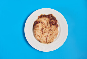 Pupusas from El Salvador dish isolated with curtido on a stylish white plate