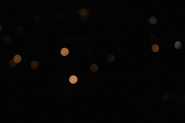 Blue and golden glitter lights in the dark, abstract blurred bokeh background. Defocused © Siya