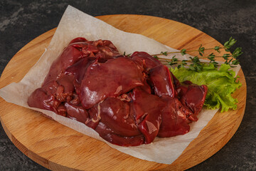 Raw chicken liver over board