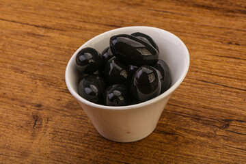 Pickled black olives in the bowl