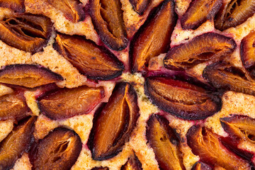 Plum pie close up. Plum cake texture