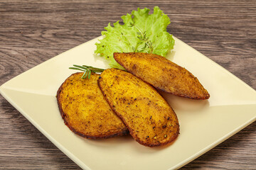 Baked potato with herbs and spices