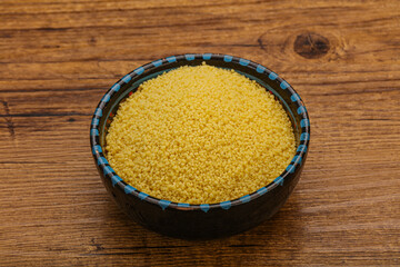 Raw cous cous heap in the bowl