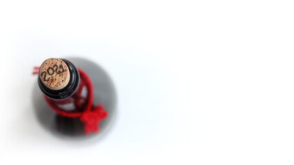 cork stopper in a wine bottle top view on a light background. holiday anticipation 2021