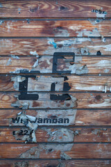 Old Wooden Wall With Poster Fragments