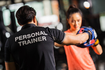 Fototapeta premium personal trainer is practicing boxing