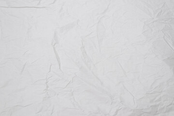 Crumpled white paper background.