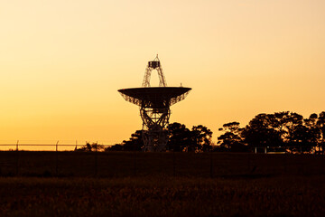 Close up isolated silhouette image of a large radio telescope antenna used for deep space...