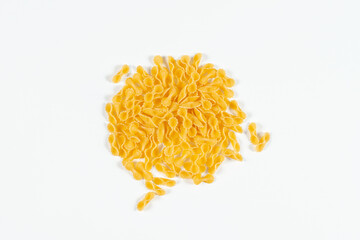 Pasta Farfalline top view on white background. Close up raw uncooked delicious pasta