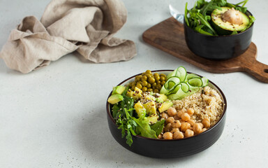 Healthy vegetable lunch from the Buddha bowl with quinoa, avocado, chickpeas. healthy food dish for vegetarians.