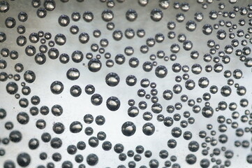 Air bubbles in a bright space in a metallic glow