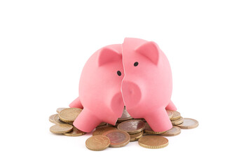Broken piggy bank with coins on white background with clipping path