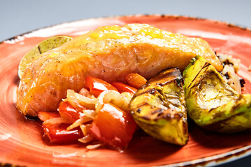 Salmon piece with rice and lime side view