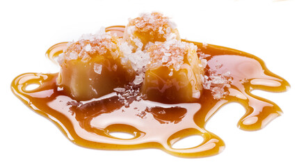 Salted caramel candies covered with melted sugar caramel isolated on white background.