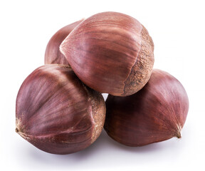 Raw peeled edible chestnut fruits isolated on white background.