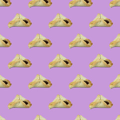 Purim. Jewish holiday seamless pattern with hamantashen on pink background. Minimal concept.