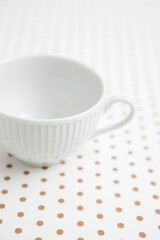 Fototapeta na wymiar coffee cup on dot pattern paper