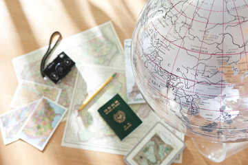 camera, passport and map