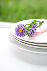 Obraz na płótnie Canvas purple flower on plate