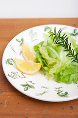 slice of lemon and vegetable on plate