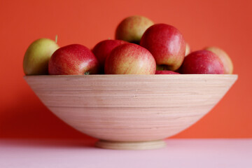 Ripe and juicy apples in a bamboo bowl. Harvest apples. Organic food. Vitamins.