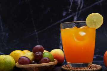 orange juice in a glass with ice