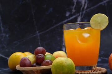 chilled orange juice on table background, summer drinks