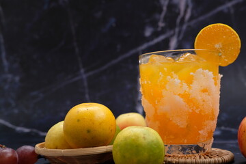chill orange juice with ice on table and summer drinking